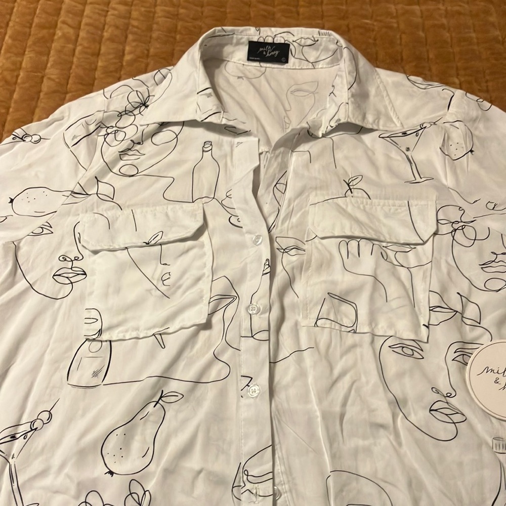 Milk and Honey rayon face print button from blouse.
